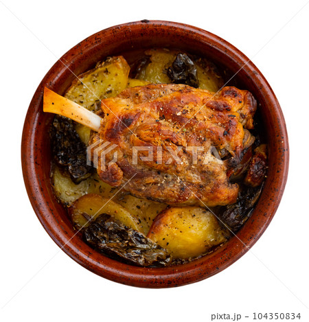 Pork knuckle with potatoes and stewed bell peppers close up 104350834