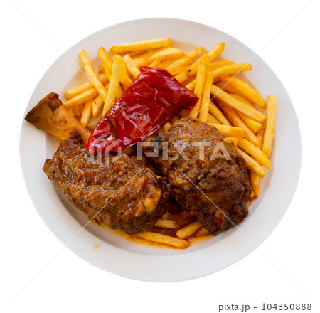 Fried shank with French fries and red pepper 104350888