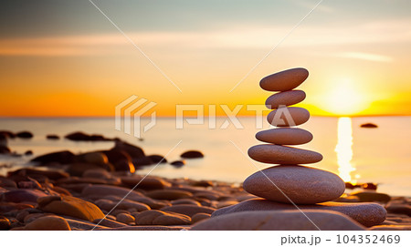 Tranquil Harmony Serene Sunrise with a Stack of Pebbles on the Beach, Symbolizing Life Balance and Peaceful Mind. created with Generative AI 104352469
