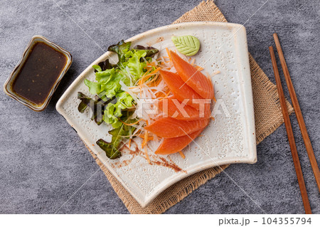 Salmaon Sashimi on white plate, ready to Eat Salmaon Sashimi on white plate, ready to Eat 104355794