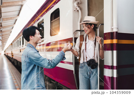 Asian couple at railway station have happy moment. Tourism and travel in the summer 104359009