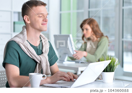 young people working in office young people working in office 104360088