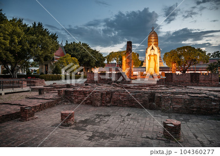 Standing Buddha image it time evening the landmark in Phitsanulok Province, Thailand. Standing Buddha image it time evening the landmark in Phitsanulok Province, Thailand. 104360277