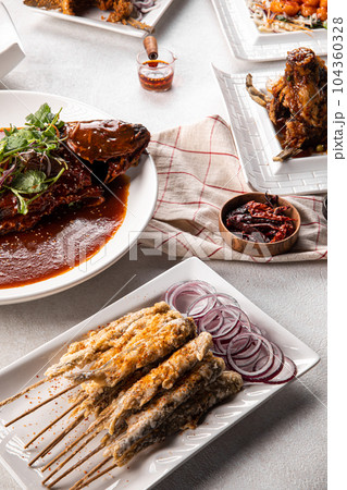 Asian chinese dishes with capelin fish 104360328