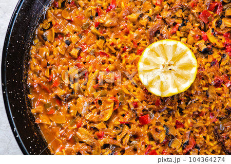 Frying pan with delicious paella Frying pan with delicious paella 104364274