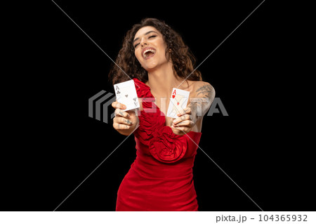 Lucky excited girl poker player showing winning pair of aces Lucky excited girl poker player showing winning pair of aces 104365932