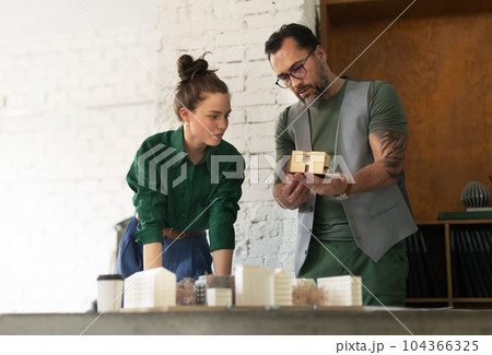 Young couple working as architects in the office. 104366325
