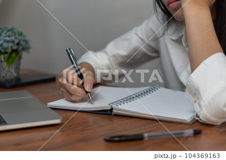 Education, development and intelligence cognition learning concept. Businessperson reading and writing on book.education studying knowledge development and cognition learning concept. 104369163