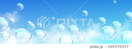 Realistic soap bubbles flying high in blue skyのイラスト素材