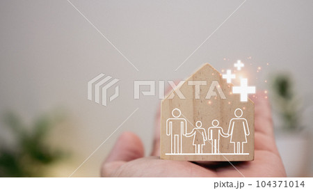 Good health and insurance concept. The concept of health insurance. Human hand holding plus sign and house model. positive volume Good health and insurance concept. The concept of health insurance. Human hand holding plus sign and house model. positive volume 104371014