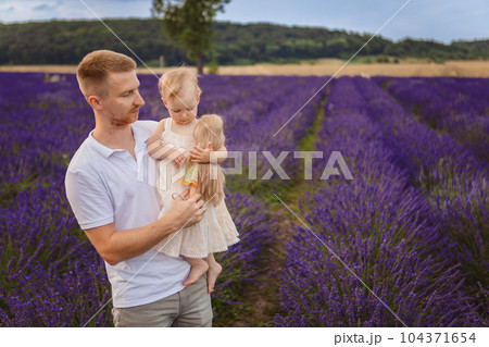 father holds his daughter father holds his daughter 104371654