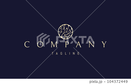 Vector golden logo on which an abstract image of plants with leaves in a circle. 104372449