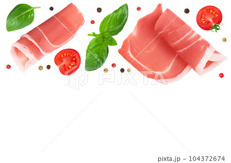 Italian prosciutto crudo or spanish jamon. Raw ham isolated on white background. Top view with copy space for your text. . Flat lay Italian prosciutto crudo or spanish jamon. Raw ham isolated on white background. Top view with copy space for your text. . Flat lay 104372674