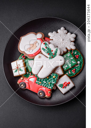 Beautiful Christmas or New Year colorful homemade gingerbread cookies Beautiful Christmas or New Year colorful homemade gingerbread cookies 104373644