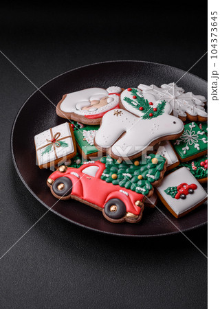 Beautiful Christmas or New Year colorful homemade gingerbread cookies Beautiful Christmas or New Year colorful homemade gingerbread cookies 104373645