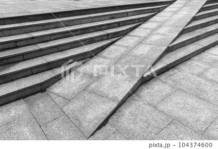 Gray granite stairs with a ramp, abstract outdoor urban architecture 104374600