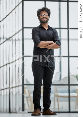 Successful young man crossed arms. Handsome businessman smart man in casual shirt. Successful young man crossed arms. Handsome businessman smart man in casual shirt. 104378042