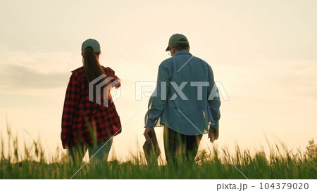 business partners field sunset, agriculture, farming farm, successful farmer tells worker, land partnership agronomists, produce grow organic plants, farmers cooperation agriculture, eco industry business partners field sunset, agriculture, farming farm, successful farmer tells worker, land partnership agronomists, produce grow organic plants, farmers cooperation agriculture, eco industry 104379020