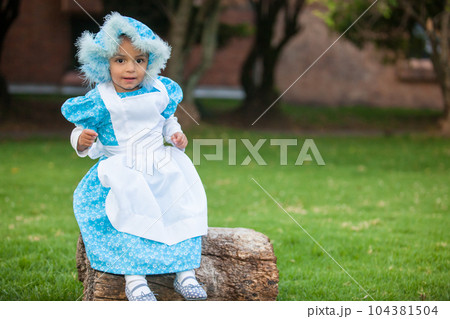 Little girl on grandma costume. Real family having fun while using costumes of the Little red riding hood tale in Halloween. Little girl on grandma costume. Real family having fun while using costumes of the Little red riding hood tale in Halloween. 104381504