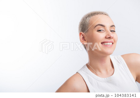 Beautiful young caucasian woman with a short haircut on a white background. Beautiful young caucasian woman with a short haircut on a white background. 104383141