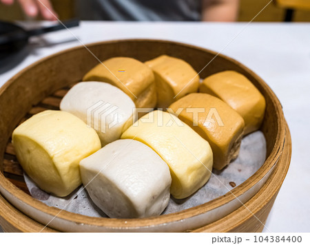 Steamed bun in bamboo steamer 104384400