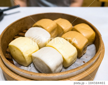Steamed bun in bamboo steamer 104384401