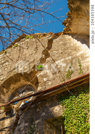 Abandoned old catholic church, damaged by the earthquake in 1979 in the town of Prcanj Montenegro 104385398