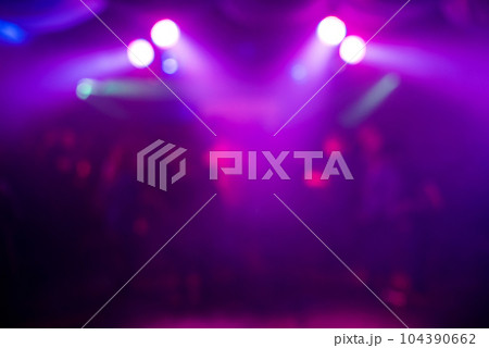 blurry purple background with abstract spots of light 104390662