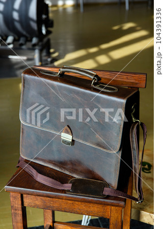 close-up photo of brown leather briefcase corporate. 104391336