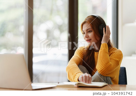 Beautiful young Asian woman college student at classroom. College student working on the college campus. back to school concept Beautiful young Asian woman college student at classroom. College student working on the college campus. back to school concept 104391742
