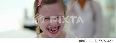 Little funny girl laughing at doctor appointment at clinic 104392027