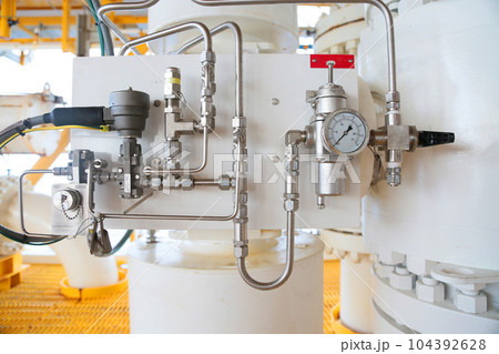 Close up of controller unit or control process of oil and gas process on the platform. The controller for control any equipment of oil and gas process by technician or control room. Close up of controller unit or control process of oil and gas process on the platform. The controller for control any equipment of oil and gas process by technician or control room. 104392628