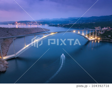 Bridge over the sea at sunset. Aerial view of modern Krk bridge 104392718