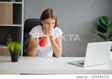 Unhappy young worker suffering from aching teeth in the office Unhappy young worker suffering from aching teeth in the office 104393239