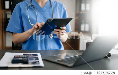 Medical technology concept. Doctor working with mobile phone and stethoscope in office. 104396779
