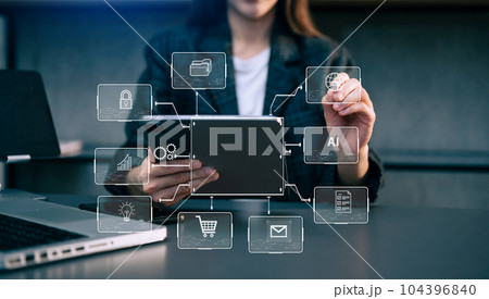 Businessman hand working digital marketing media in virtual screen with mobile phone and modern compute with VR icon diagram at office Businessman hand working digital marketing media in virtual screen with mobile phone and modern compute with VR icon diagram at office 104396840