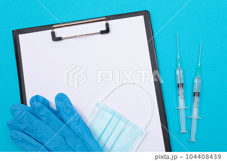 Vaccination or Revaccination Concept - Two Medical Syringe on Blue Table 104408439