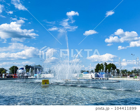 Fountain park in Warsaw, Poland, blue sky, summer time Fountain park in Warsaw, Poland, blue sky, summer time 104411899