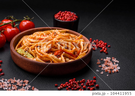 Delicious asian udon dish with vegetables, mushrooms, salt and spices Delicious asian udon dish with vegetables, mushrooms, salt and spices 104411955
