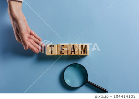 Wooden cubes with words TEAM, together everyone achieves more. Business, motivational and TEAM concept. Wooden cubes with words TEAM, together everyone achieves more. Business, motivational and TEAM concept. 104414105