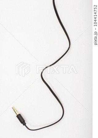 3.5mm headphone jack with wire lies on a white background isolate 104414752