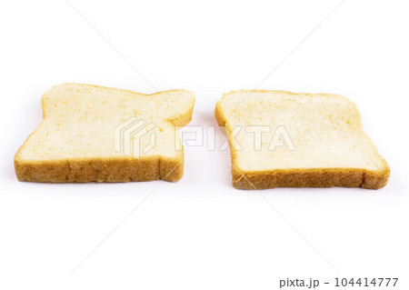 two slices of bread for toast on a white background two slices of bread for toast on a white background 104414777