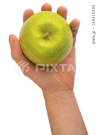 in a hand a green apple isolated on white isolated background in a hand a green apple isolated on white isolated background 104415595