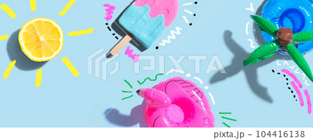 Summer concept with a flamingo float, lemon sunlight and a popsicle Summer concept with a flamingo float, lemon sunlight and a popsicle 104416138