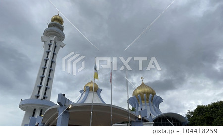 Low angle view of mosque against cloudy sky Low angle view of mosque against cloudy sky 104418259