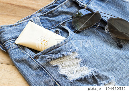 sunscreen spf50 health care for skin face with sunglasses, denim of lifestyle woman 104420552