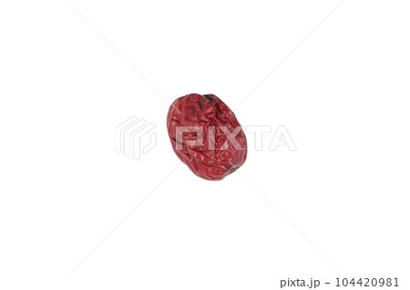 One cherry tomato placed on a white background 104420981