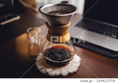 Drip coffee on the desk in the morning 104422759