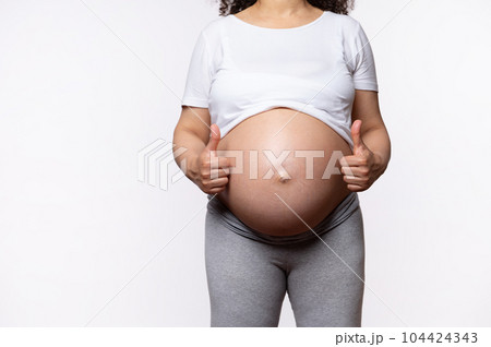 Close-up pregnant woman with naked belly, - Stock Photo