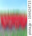 A field with red colors in vertical blurred motion 104424715